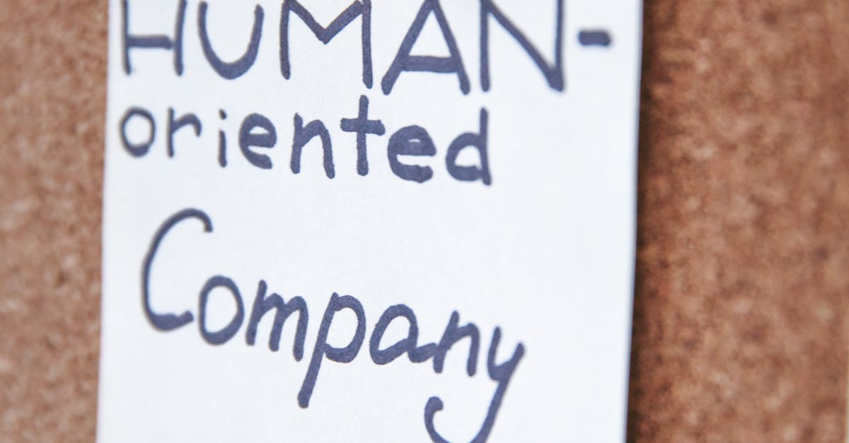 Handwritten notes on a corkboard illustrating a human-oriented company concept. Ideal for business innovation themes.